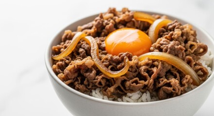 Fototapeta premium Gyudon, Delicious Bowl of Rice Topped with Savory Beef and Egg Yolk