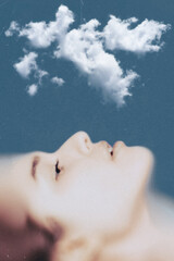 Fototapeta premium Woman's profile looking up at a cloud, visualizing peace and imagination