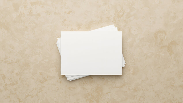 Stack of White Paper Sheets on Beige Surface in Office or Workspace