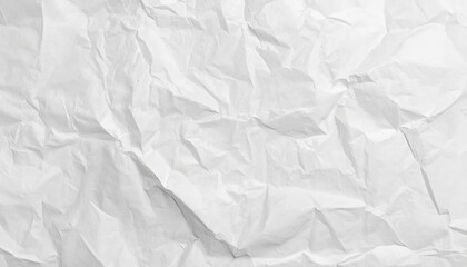 Obraz premium A crumpled white paper texture with deep creases and folds