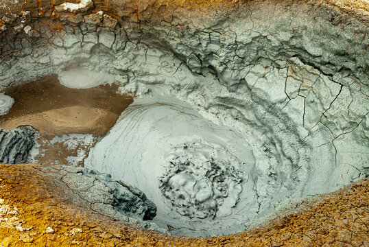Abstract Geothermal Mud Pool Texture at N&aacute;mskar&eth;, Iceland &ndash; Bubbling Grey Clay and Mineral Surface Close-Up