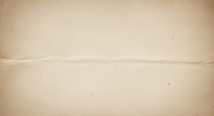 Fototapeta premium Aged paper texture with horizontal torn crease. Surface shows subtle stains, specks, and wear marks creating authentic vintage look. Perfect for backgrounds, scrapbooking, or historical designs.