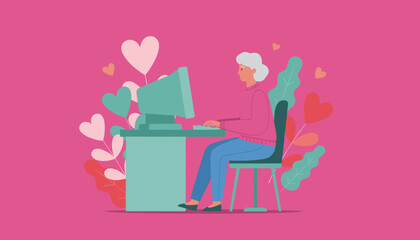 Happy senior woman uses a desktop computer for online dating or connection surrounded by romantic hearts