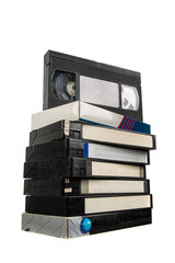 Obraz premium Stack of vintage black VHS video tapes with blank white labels isolated on white back