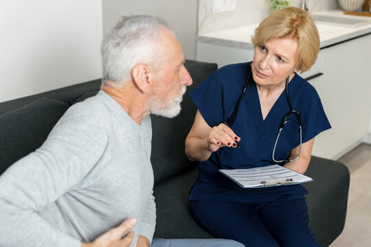 Doctor visits patient at home for consultation and health support