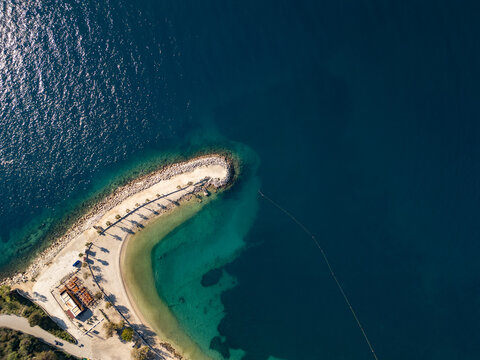   aerial view of a tropical beach with palm trees and turquoise water. Abstract coastal summer background.