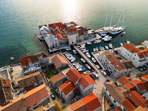 Kastel Gomilica Croatia historic island fortress and ancient stone castle tower aerial drone view.
