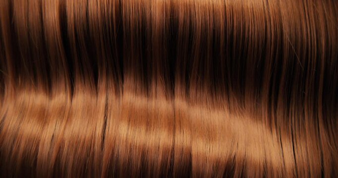 Ultra slow motion shot of dark brown hair flowing in smooth, elegant waves, forming natural curves and motion. Captured at 1000 fps, revealing fine texture, shine, and fluid cinematic movement.