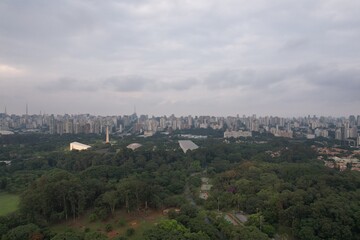 Fototapeta premium Skyline view of Sao Paulo with green space in the foreground at dusk