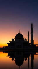 Naklejka premium Silhouette of mosque at sunset.
