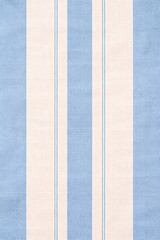 Fototapeta premium Heavy striped fabric texture in white and light blue inspired by coastal homes and elegant seaside interior decor