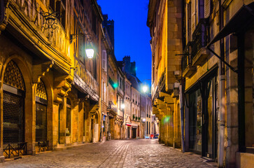Obraz premium Old medieval houses buildings on Rue Verrerie pedestrian street in Dijon city historical centre, Dijon old town centre ville on twilight dusk evening view, Bourgogne-Franche-Comte region, France