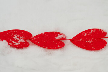 red hearts on the snow=