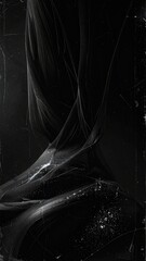 Abstract monochrome composition featuring swirling dark textures and white dust particles over a scratched surface.