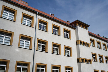 Obraz premium Geometric facade of a historic residential building in Cologne-Bickendorf. Example of interwar reform architecture and urban social housing design