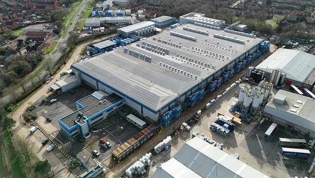 Aerial view of the expansive Colt Data Centre services, a symphony of steel and concrete under a muted winter sky, Welwyn Garden City, United Kingdom.