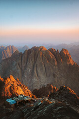 Naklejka premium Egypt landscape - mountain of Moses and traditional bedouin hut aerial view, famous Christian landmark in Sinai peninsula travel epic destinations, Jabal Mousa beautiful sunrise rocks scenery