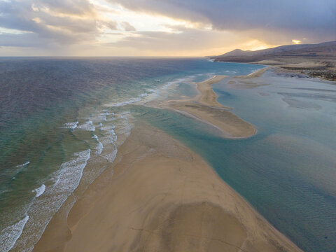 Aerial view of the golden sands of the Peninsula and the lagoon in Jandia, with turquoise waters at sunset, Jand&Atilde;&shy;a Natural Park, Fuerteventura, Canary Islands, Spain.