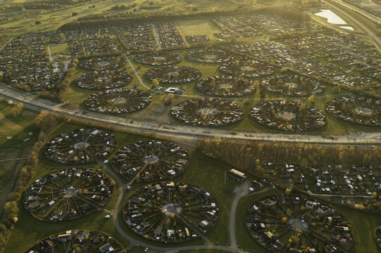 Aerial view of concentric circles of garden allotments create a mesmerizing pattern against the green landscape, Harek&Atilde;&brvbar;rvej, Br&Atilde;&cedil;ndby, Denmark.