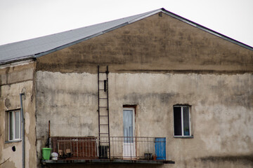 The top floor of a house with a roof and stairs
