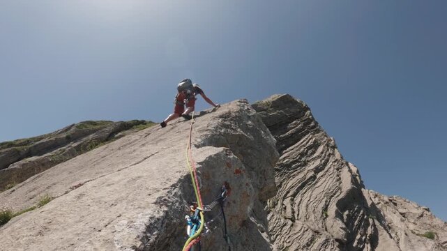 Rock Climber on Pic de l Aiguille East Face Ridge in Alps