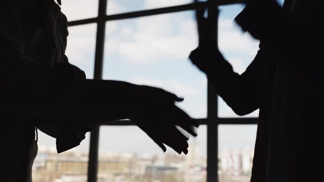 Emotional couple arguing and gesturing hands during relationship crisis