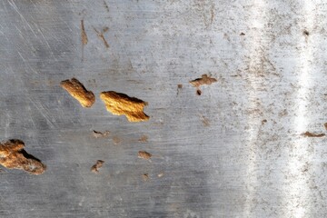 Close-Up of Scratched Metal Sheet with Visible Rust Details