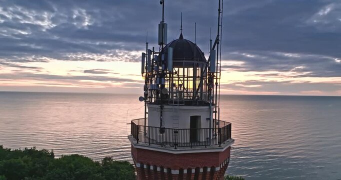 Beautiful lighthouse at sunset in Rewal at Baltic Sea.