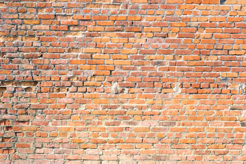 Naklejka premium Grunge orange brick wall background texture