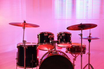 Modern drum kit in studio, closeup. Musical instrument