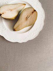 Pear on a plate. Still life aesthetic