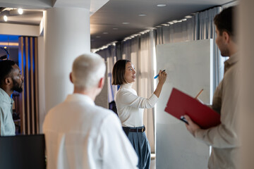 Business colleagues collaborating on project during office meeting