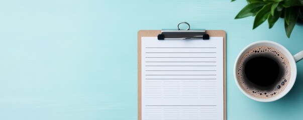 Top-down view of a clipboard with lined paper and a cup of coffee on a blue wooden desk, Workstation, Planning, Coffee Break