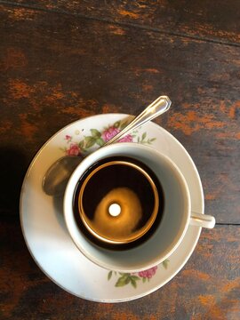 cup of coffee on wooden table