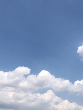 Clear Blue Sky with Soft Clouds