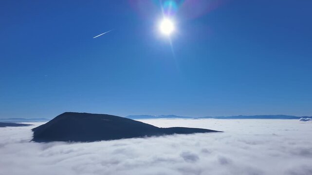 Pano drone movement over a huge valley of mist. Winter time, pollution, fog, mist. 