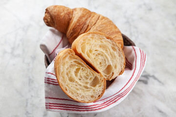 Croissant, Coffee and Jam on Marble Surface. Minimal Breakfast Concept with Croissant, Jam and Coffee. French Style Breakfast on Marble Background.