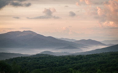 Fototapeta premium Misty mountain ridges at sunrise, Tarnica peak in Bieszczady Mountains, Poland