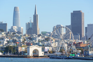 View of San Francisco from a tour boat in the middle of the bay, capturing the city skyline, waterfront, and iconic landmarks. Scenic perspective from the water, ideal for travel, tourism, and maritim