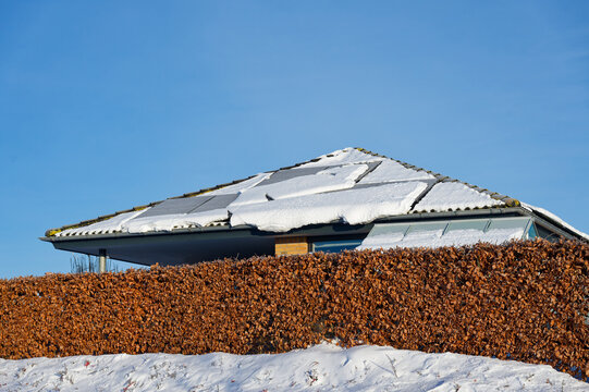 Solar Panels Shaded by Snow in Winter Showing Reduced Energy Efficiency