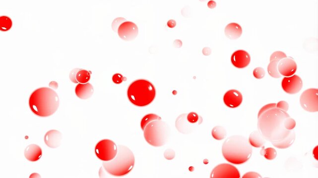 Red bubbles floating against a white background. Ideal for creative projects, conveying joy, celebration, and vibrant energy