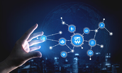 Fototapeta premium A hand reaches toward a visual representation of data connections in a night city, highlighting themes of technology, innovation, and digital networking. Tessel