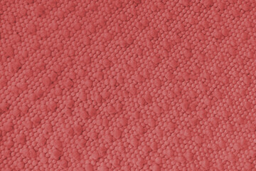 Fototapeta premium Red jacquard upholstery fabric with raised fluffy pom pom pattern, weave creating rich textured cloth surface. Decorative textile background for furniture, interior design, upholstery backdrop