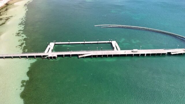 Port Lincoln, South Australia &ndash; 4K aerial drone view of coastal city, jetty, turquoise bay, beachfront, marina, suburban houses, residential estates and Eyre Peninsula shoreline