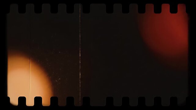 Vintage dark 35mm film frame with perforations and soft light leaks, offering a nostalgic and retro cinematic overlay effect for creative design projects.