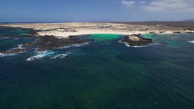 Aerial view of Playa De La Concha, El Cotillo, Fuerteventura, Canary islands, Spain. 2x speeded up from 30 fps.