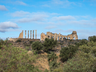 Fototapeta premium Exterior view of the Basilica and the Capitoline Temple at Volubilis, UNESCO heritage. Complex of ruins of the Roman city Volubilis - Meknes region, Morocco, North Africa