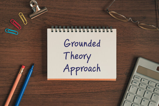There is notebook with the word Grounded Theory Approach. It is as an eye-catching image.