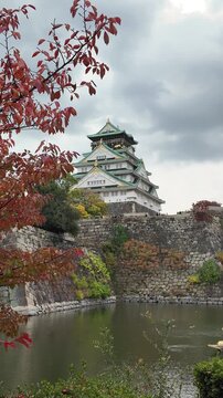 Osaka Castle Surrounded by Moat and Autumn Foliage