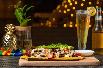 Loaded patacón with carne asada and avocado © STOCKEROcr